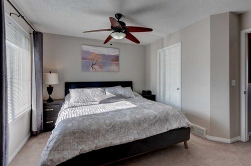 219 Copperfield Lane Se, Calgary, AB - Indoor Photo Showing Bedroom