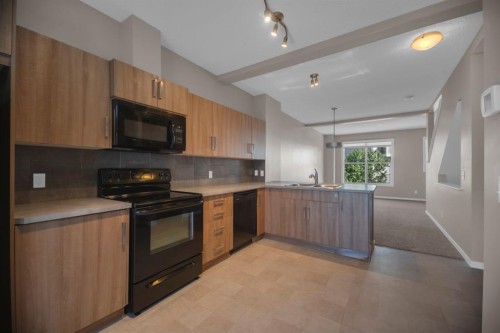 136 New Brighton Point Se, Calgary, AB - Indoor Photo Showing Kitchen