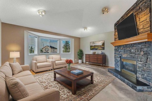 60 Citadel Peak Mews Nw, Calgary, AB - Indoor Photo Showing Living Room With Fireplace