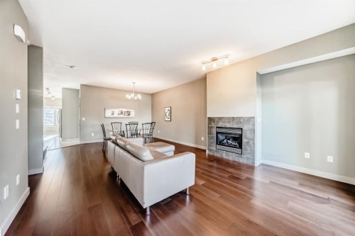 12 Cougar Ridge Landing Sw, Calgary, AB - Indoor Photo Showing Living Room With Fireplace