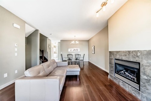 12 Cougar Ridge Landing Sw, Calgary, AB - Indoor Photo Showing Living Room With Fireplace