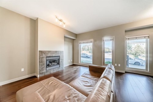12 Cougar Ridge Landing Sw, Calgary, AB - Indoor Photo Showing Living Room With Fireplace