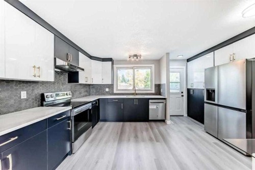 15104 1 Street Se, Calgary, AB - Indoor Photo Showing Kitchen With Stainless Steel Kitchen With Double Sink With Upgraded Kitchen