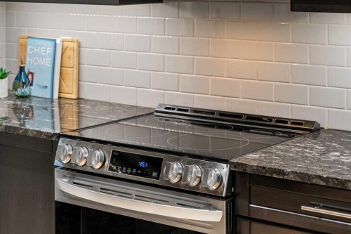 2322 Bayside Circle Sw, Airdrie, AB - Indoor Photo Showing Kitchen With Upgraded Kitchen