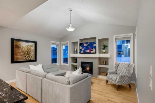 2322 Bayside Circle Sw, Airdrie, AB - Indoor Photo Showing Living Room With Fireplace