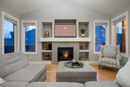 2322 Bayside Circle Sw, Airdrie, AB - Indoor Photo Showing Living Room With Fireplace