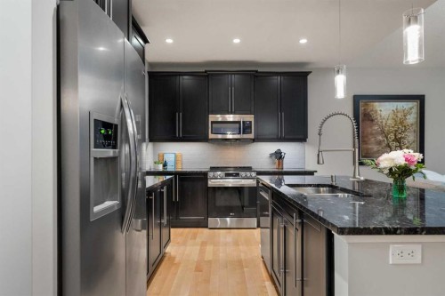 2322 Bayside Circle Sw, Airdrie, AB - Indoor Photo Showing Kitchen With Stainless Steel Kitchen With Double Sink With Upgraded Kitchen