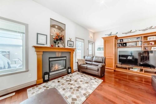 252 18 Avenue Nw, Calgary, AB - Indoor Photo Showing Living Room With Fireplace
