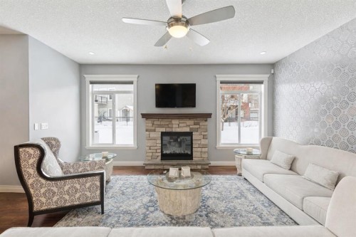 135 Auburn Sound Manor Se, Calgary, AB - Indoor Photo Showing Living Room With Fireplace