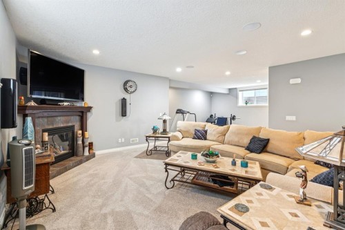 135 Auburn Sound Manor Se, Calgary, AB - Indoor Photo Showing Living Room With Fireplace