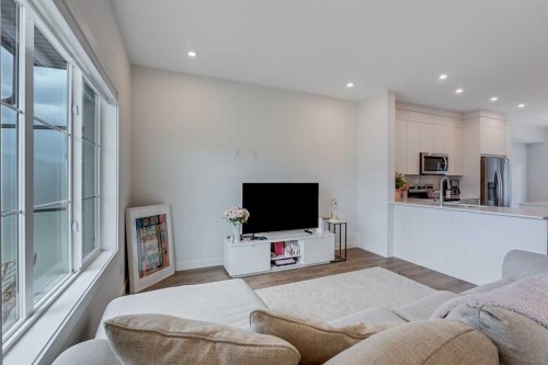 302-6 Merganser Drive, Chestermere, AB - Indoor Photo Showing Living Room