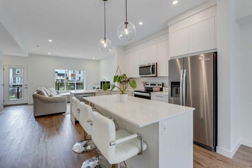 302-6 Merganser Drive, Chestermere, AB - Indoor Photo Showing Kitchen With Stainless Steel Kitchen