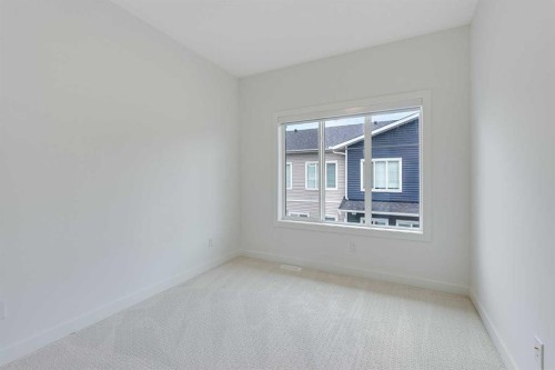 302-6 Merganser Drive, Chestermere, AB - Indoor Photo Showing Other Room
