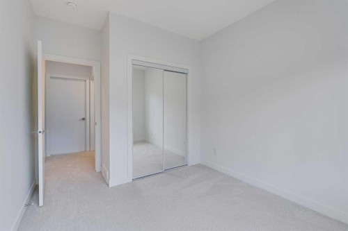 302-6 Merganser Drive, Chestermere, AB - Indoor Photo Showing Other Room