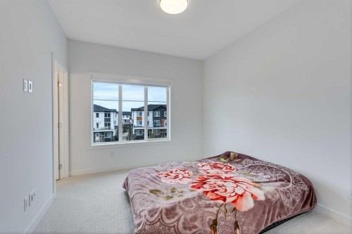 302-6 Merganser Drive, Chestermere, AB - Indoor Photo Showing Bedroom