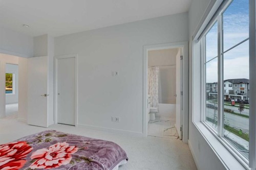 302-6 Merganser Drive, Chestermere, AB - Indoor Photo Showing Bedroom