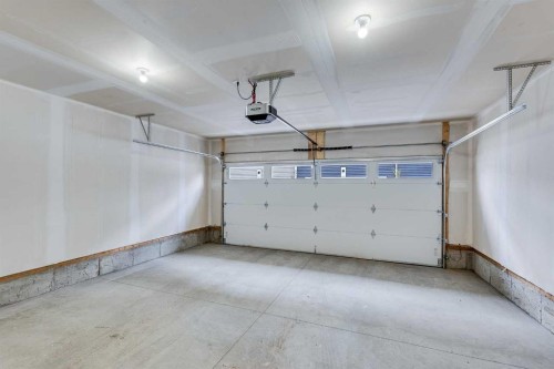 302-6 Merganser Drive, Chestermere, AB - Indoor Photo Showing Garage