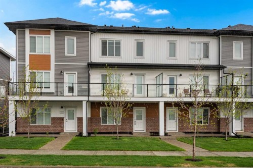 302-6 Merganser Drive, Chestermere, AB - Outdoor With Balcony With Facade