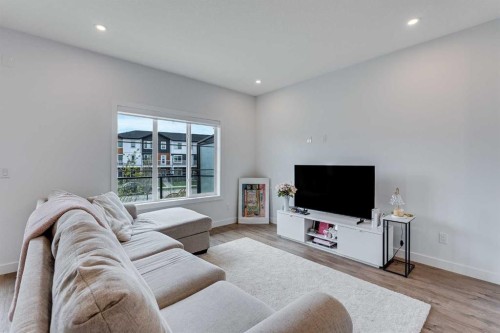 302-6 Merganser Drive, Chestermere, AB - Indoor Photo Showing Living Room