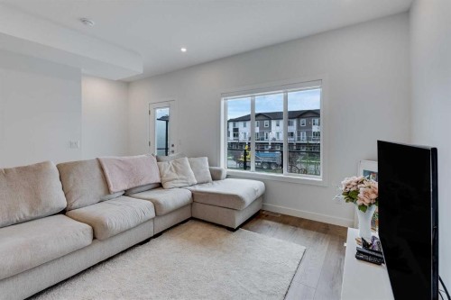 302-6 Merganser Drive, Chestermere, AB - Indoor Photo Showing Living Room