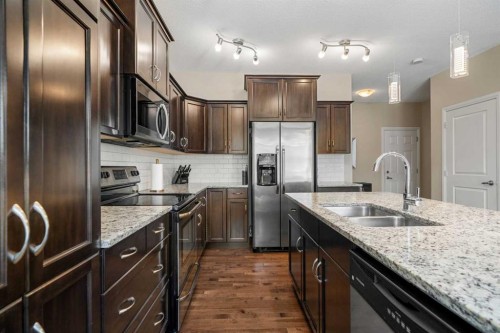 48 Evanswood Circle Nw, Calgary, AB - Indoor Photo Showing Kitchen With Double Sink With Upgraded Kitchen