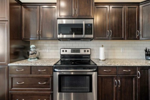 48 Evanswood Circle Nw, Calgary, AB - Indoor Photo Showing Kitchen With Upgraded Kitchen