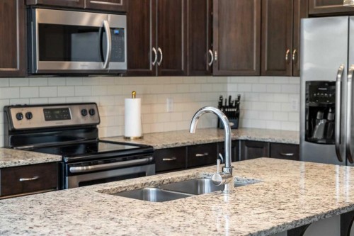 48 Evanswood Circle Nw, Calgary, AB - Indoor Photo Showing Kitchen With Double Sink With Upgraded Kitchen