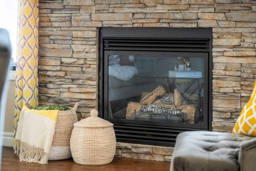 48 Evanswood Circle Nw, Calgary, AB - Indoor Photo Showing Living Room With Fireplace