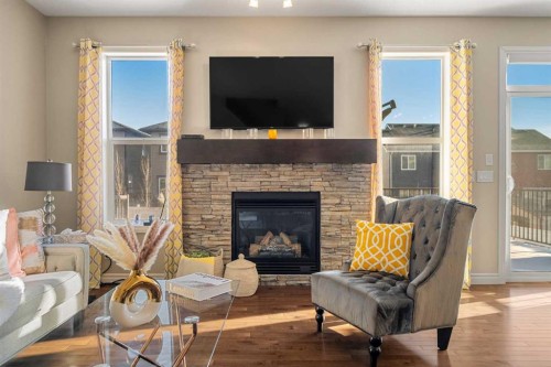 48 Evanswood Circle Nw, Calgary, AB - Indoor Photo Showing Living Room With Fireplace