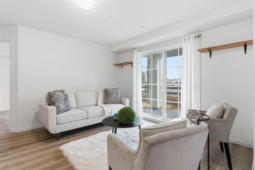 4114-99 Copperstone Park Se, Calgary, AB - Indoor Photo Showing Living Room