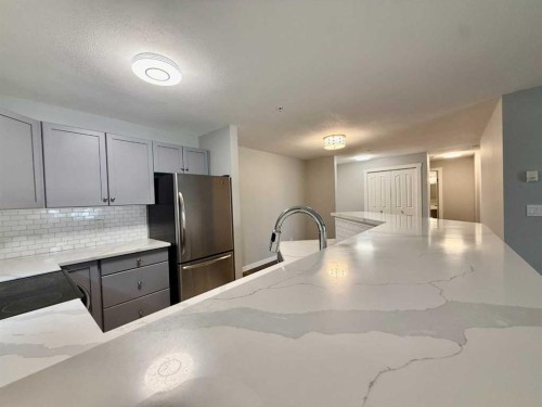 1212-2518 Fish Creek Boulevard Sw, Calgary, AB - Indoor Photo Showing Kitchen