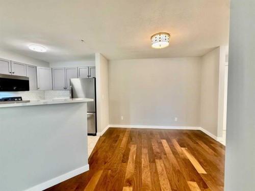 1212-2518 Fish Creek Boulevard Sw, Calgary, AB - Indoor Photo Showing Kitchen