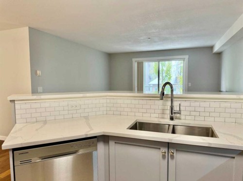 1212-2518 Fish Creek Boulevard Sw, Calgary, AB - Indoor Photo Showing Kitchen With Double Sink