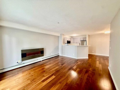 1212-2518 Fish Creek Boulevard Sw, Calgary, AB - Indoor Photo Showing Living Room