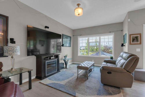 138 Reunion Landing, Airdrie, AB - Indoor Photo Showing Living Room With Fireplace