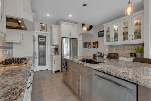 138 Reunion Landing, Airdrie, AB - Indoor Photo Showing Kitchen With Stainless Steel Kitchen With Double Sink With Upgraded Kitchen