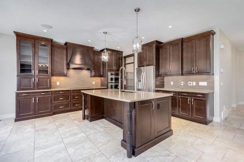 202 Cooperstown Lane Sw, Airdrie, AB - Indoor Photo Showing Kitchen With Stainless Steel Kitchen With Upgraded Kitchen