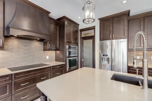 202 Cooperstown Lane Sw, Airdrie, AB - Indoor Photo Showing Kitchen With Stainless Steel Kitchen With Upgraded Kitchen
