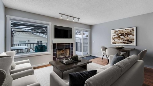 3667 Sierra Morena Road Sw, Calgary, AB - Indoor Photo Showing Living Room With Fireplace