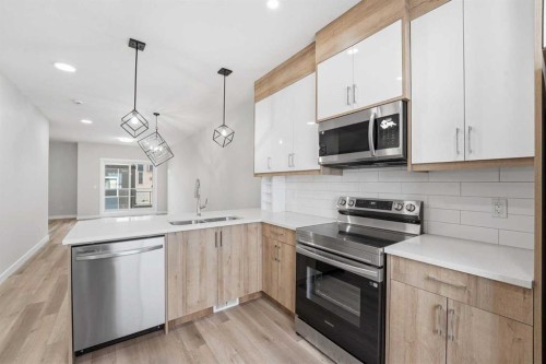 628 Red Sky Villas Ne, Calgary, AB - Indoor Photo Showing Kitchen With Stainless Steel Kitchen With Double Sink With Upgraded Kitchen