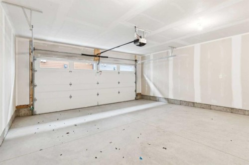 122-1862 Cornerstone Boulevard, Calgary, AB - Indoor Photo Showing Garage