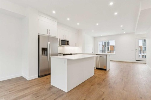 122-1862 Cornerstone Boulevard, Calgary, AB - Indoor Photo Showing Kitchen With Stainless Steel Kitchen With Upgraded Kitchen