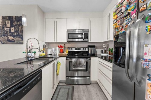3407-11 Mahogany Row Se, Calgary, AB - Indoor Photo Showing Kitchen With Stainless Steel Kitchen With Double Sink