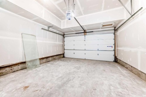 109 Heritage Park, Cochrane, AB - Indoor Photo Showing Garage