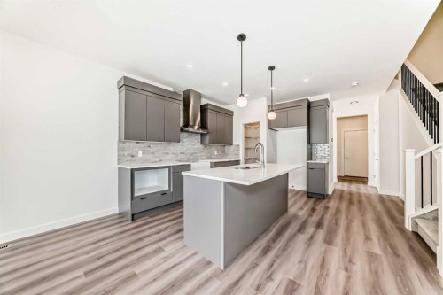 109 Heritage Park, Cochrane, AB - Indoor Photo Showing Kitchen With Upgraded Kitchen