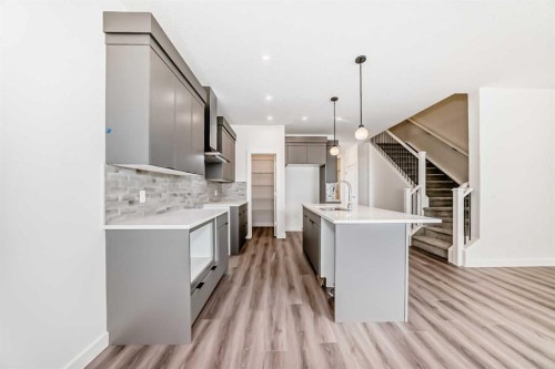 109 Heritage Park, Cochrane, AB - Indoor Photo Showing Kitchen With Upgraded Kitchen