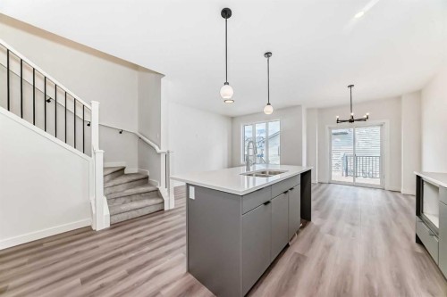 109 Heritage Park, Cochrane, AB - Indoor Photo Showing Kitchen With Double Sink