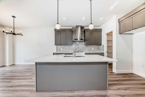109 Heritage Park, Cochrane, AB - Indoor Photo Showing Kitchen With Double Sink With Upgraded Kitchen