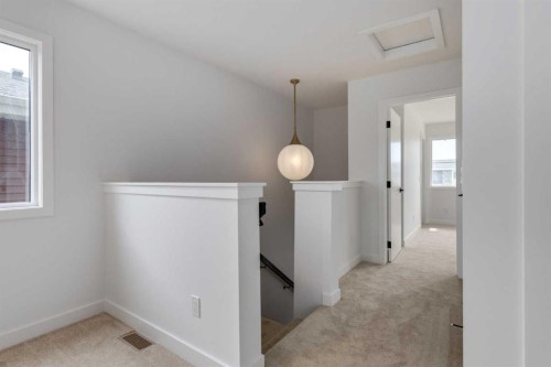 74 Agate Road, Cochrane, AB - Indoor Photo Showing Other Room