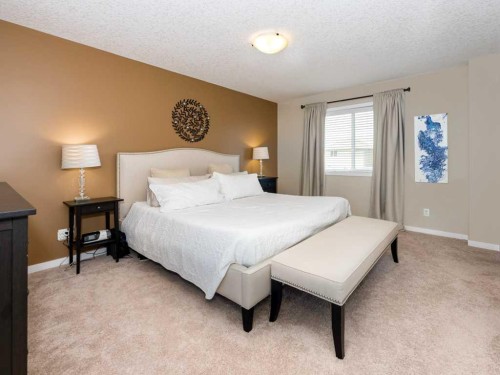14 Walden Road Se, Calgary, AB - Indoor Photo Showing Bedroom